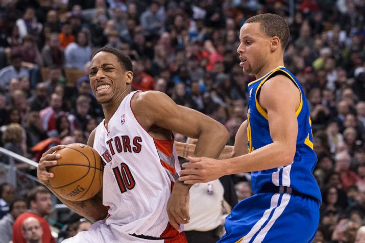Toronto Raptors' DeMar DeRozan, left, drives past Golden State Warriors' Stephen Curry during the second half of an NBA basketball game in Toronto on Sunday, March 2, 2014. (AP photo/The Canadian Press, Chris Young)