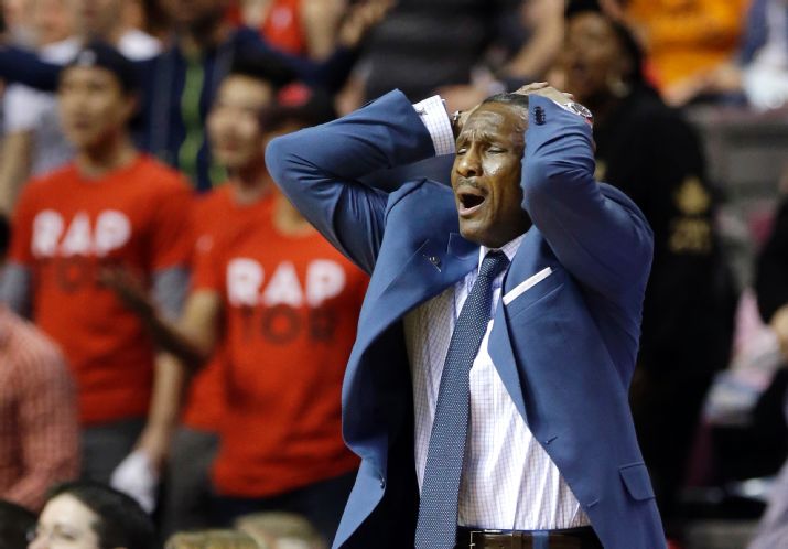 Toronto Raptors head coach Dwane Casey reacts after a call during the second half of an NBA basketball game against the Detroit Pistons in Auburn Hills, Mich., Sunday, April 13, 2014. The Raptors won 116-107. (AP Photo/Carlos Osorio)