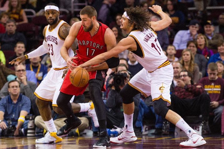 CLEVELAND, OH - DECEMBER 9: LeBron James #23 and Anderson Varejao #17 of the Cleveland Cavaliers defend against Jonas Valanciunas #17 of the Toronto Raptors during the first half at Quicken Loans Arena on December 9, 2014 in Cleveland, Ohio. NOTE TO USER: User expressly acknowledges and agrees that, by downloading and or using this photograph, User is consenting to the terms and conditions of the Getty Images License Agreement. (Photo by Jason Miller/Getty Images)