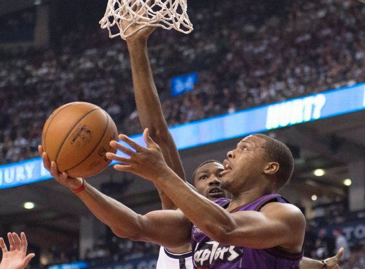 Toronto Raptors' Kyle Lowry drives to the basket in front of Brooklyn Nets' Cory Jefferson during the first half of an NBA basketball game Wednesday, Dec. 17, 2014, in Toronto. (AP Photo/The Canadian Press, Frank Gunn)