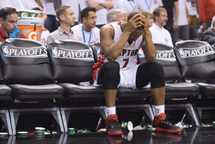 Toronto Raptors' Kyle Lowry sits on the bench after fouling out of the game during fourth quarter against the Washington Wizards in Game 1 in the first round of the NBA basketball playoffs, Saturday, April 18, 2015, in Toronto. The Wizards won 93-86 in overtime. (Frank Gunn/The Canadian Press via AP) MANDATORY CREDIT