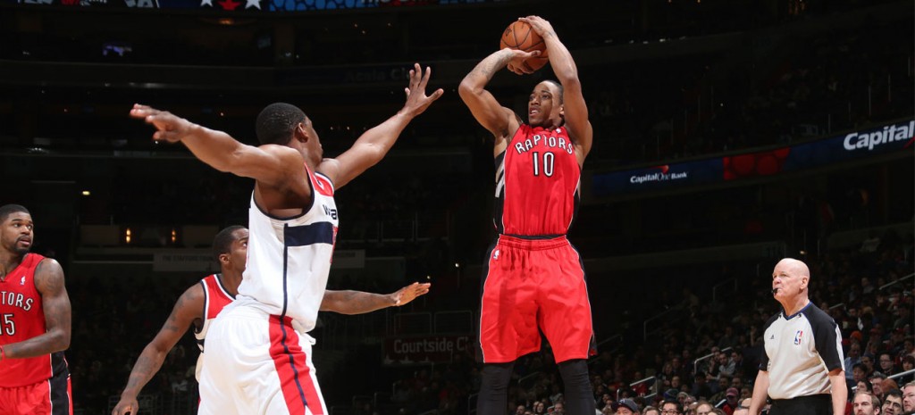 WASHINGTON, DC - JANUARY 3: DeMar DeRozan #10 of the Toronto Raptors shoots against Kevin Seraphin #13 of the Washington Wizards during the game at the Verizon Center on January 3, 2014 in Washington, DC. NOTE TO USER: User expressly acknowledges and agrees that, by downloading and or using this photograph, User is consenting to the terms and conditions of the Getty Images License Agreement. Mandatory Copyright Notice: Copyright 2014 NBAE (Photo by Ned Dishman/NBAE via Getty Images)