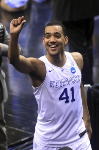 Kentucky's Trey Lyles waves after the team's 78-39 win over West Virginia in a college basketball game in the NCAA men's tournament regional semifinals, Friday, March 27, 2015, in Cleveland. Kentucky advanced to face Notre Dame in the regional finals Saturday. (AP Photo/Aaron Josefczyk)
