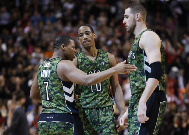 Toronto Raptors' Kyle Lowry, left, celebrates his three point shot with  DeMar DeRozan against Minnesota Timberwolves in last minute second half NBA  action in Toronto, Friday January 17, 2014. THE CANADIAN PRESS/Mark