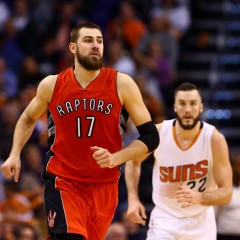 Jan 4, 2015; Phoenix, AZ, USA; Toronto Raptors center center Jonas Valanciunas (17) and Phoenix Suns center Miles Plumlee (22) at US Airways Center. The Suns defeated the Raptors 125-109. Mandatory Credit: Mark J. Rebilas-USA TODAY Sports