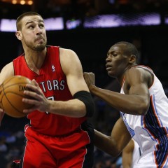 Toronto Raptors center Jonas Valanciunas (L) of Lithuania prepares to shoot around Charlotte Bobcats power forward Bismack Biyombo of the Democratic Republic of Congo during the first half of their NBA basketball game in Charlotte, North Carolina March 20, 2013. REUTERS/Chris Keane (UNITED STATES - Tags: SPORT BASKETBALL)