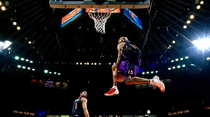 Vince Carter of the Toronto Raptors goes for a dunk during the