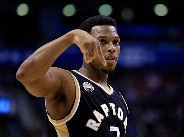 TORONTO, ON - MARCH 12: Kyle Lowry #7 of the Toronto Raptors gestures to teammates during the second half of an NBA game against the Miami Heat at the Air Canada Centre on March 12, 2016 in Toronto, Ontario, Canada. NOTE TO USER: User expressly acknowledges and agrees that, by downloading and or using this photograph, User is consenting to the terms and conditions of the Getty Images License Agreement. (Photo by Vaughn Ridley/Getty Images)