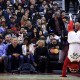 TORONTO, ON - APRIL 12: MMA fighter George St. Pierre (front row, 3rd L) laughs as The Toronto Raptors mascot, The Raptor, tries to impress him during a break in the second half of an NBA game between the Philadelphia 76ers and the Toronto Raptors at the Air Canada Centre on April 12, 2016 in Toronto, Ontario, Canada. NOTE TO USER: User expressly acknowledges and agrees that, by downloading and or using this photograph, User is consenting to the terms and conditions of the Getty Images License Agreement. (Photo by Vaughn Ridley/Getty Images)