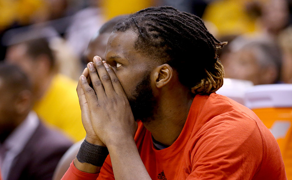 INDIANAPOLIS, IN - APRIL 29: DeMarre Carroll #5 of the Toronto Raptors watches the final minute of the 101-83 loss to the Indiana Pacers in game six of the 2016 NBA Playoffs Eastern Conference Quarterfinals on April 29, 2016 in Indianapolis, Indiana. NOTE TO USER: User expressly acknowledges and agrees that, by downloading and or using this photograph, User is consenting to the terms and conditions of the Getty Images License Agreement. (Photo by Andy Lyons/Getty Images)