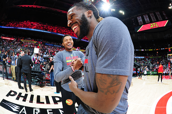 ATLANTA, GA - APRIL 7: Kent Bazemore #24 of the Atlanta Hawks and DeMarre Carroll #5 of the Toronto Raptors shake hands before the game on April 7, 2016 at Philips Arena in Atlanta, Georgia. NOTE TO USER: User expressly acknowledges and agrees that, by downloading and or using this Photograph, user is consenting to the terms and conditions of the Getty Images License Agreement. Mandatory Copyright Notice: Copyright 2016 NBAE (Photo by Scott Cunningham/NBAE via Getty Images)