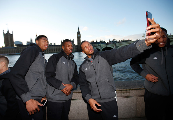 LONDON, ENGLAND - JANUARY 12: Bruno Caboclo #20, Delon Wright #55 and Norman Powell #24 of the Toronto Raptors take a selfie while sight seeing as part of 2016 London Global Games on January 12, 2016 in London, England. NOTE TO USER: User expressly acknowledges and agrees that, by downloading and/or using this Photograph, user is consenting to the terms and conditions of the Getty Images License Agreement. Mandatory Copyright Notice: Copyright 2016 NBAE (Photo by Gregory Shamus/NBAE via Getty Images)