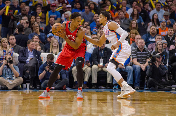 OKLAHOMA CITY, OK - NOVEMBER 09: Toronto Raptors Guard DeMar DeRozan (10) looking for a play while Oklahoma City Thunder Forward Andre Roberson (21) plays defense on November 9, 2016, at the Chesapeake Energy Arena Oklahoma City, OK. (Photo by Torrey Purvey/Icon Sportswire via Getty Images)