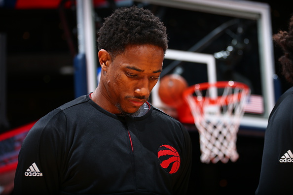 WASHINGTON, DC - NOVEMBER 2: DeMar DeRozan #10 of the Toronto Raptors honors the National Anthem before the game against the Washington Wizards on November 2, 2016 at Verizon Center in Washington, DC. NOTE TO USER: User expressly acknowledges and agrees that, by downloading and or using this Photograph, user is consenting to the terms and conditions of the Getty Images License Agreement. Mandatory Copyright Notice: Copyright 2016 NBAE (Photo by Ned Dishman/NBAE via Getty Images)