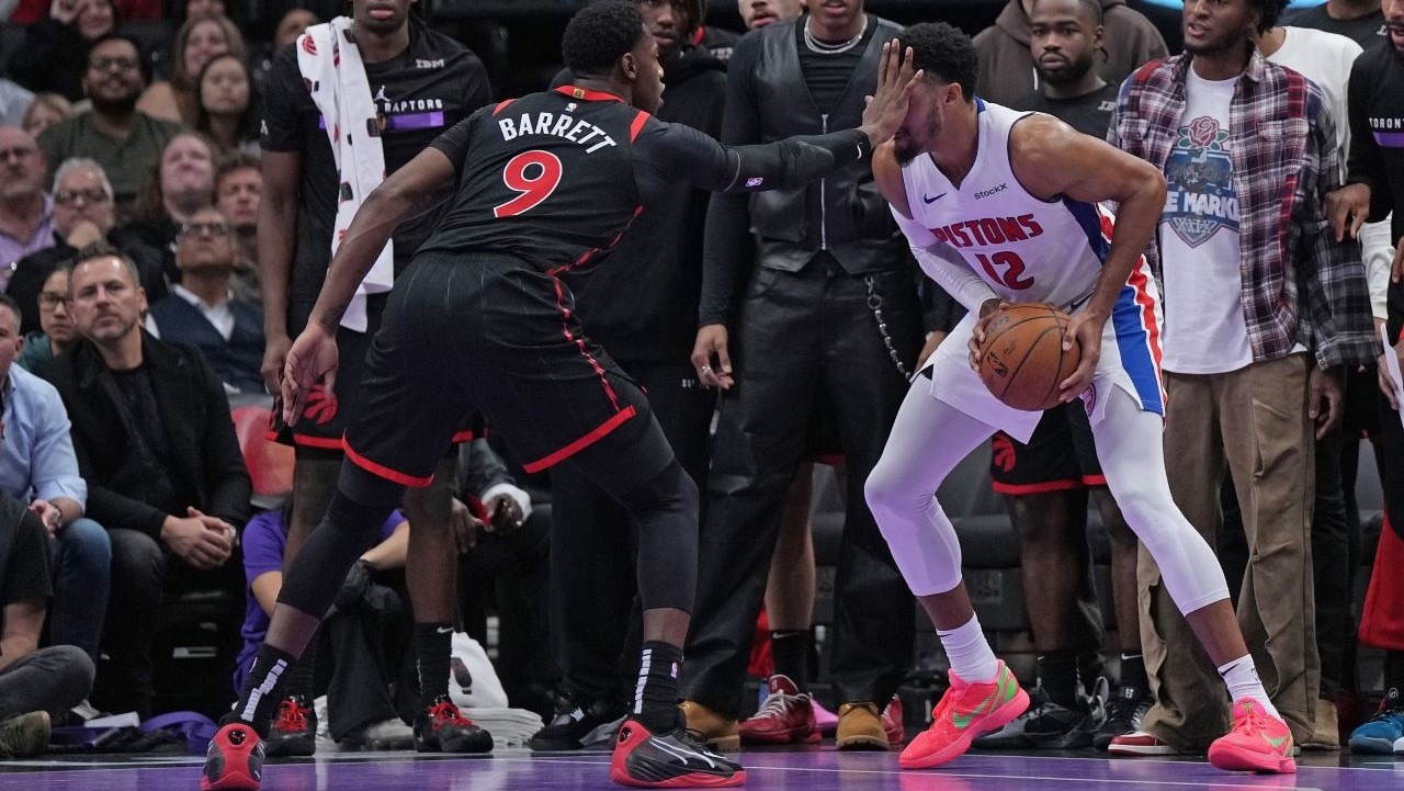 Detroit Pistons forward Tobias Harris (12) controls the ball as Toronto Raptors guard RJ Barrett (9) defends during the fourth quarter at Scotiabank Arena.