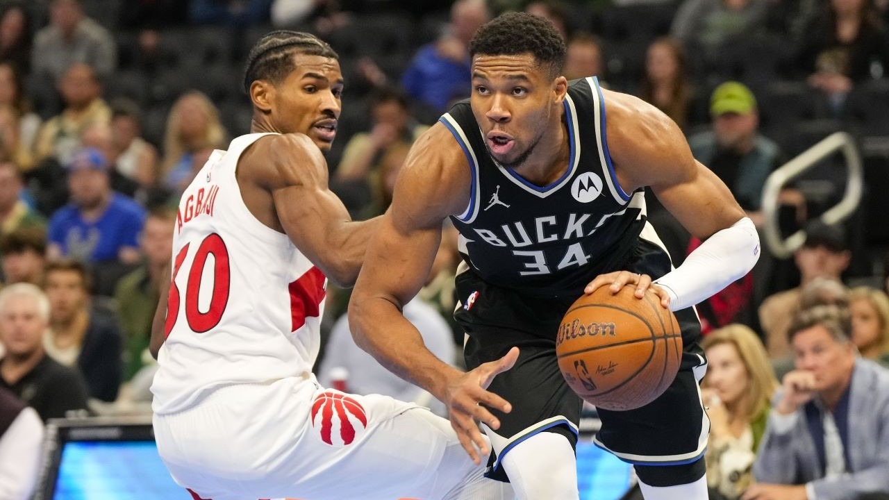 Milwaukee Bucks forward Giannis Antetokounmpo (34) drives for the basket around Toronto Raptors guard Ochai Agbaji (30) during the fourth quarter at Fiserv Forum